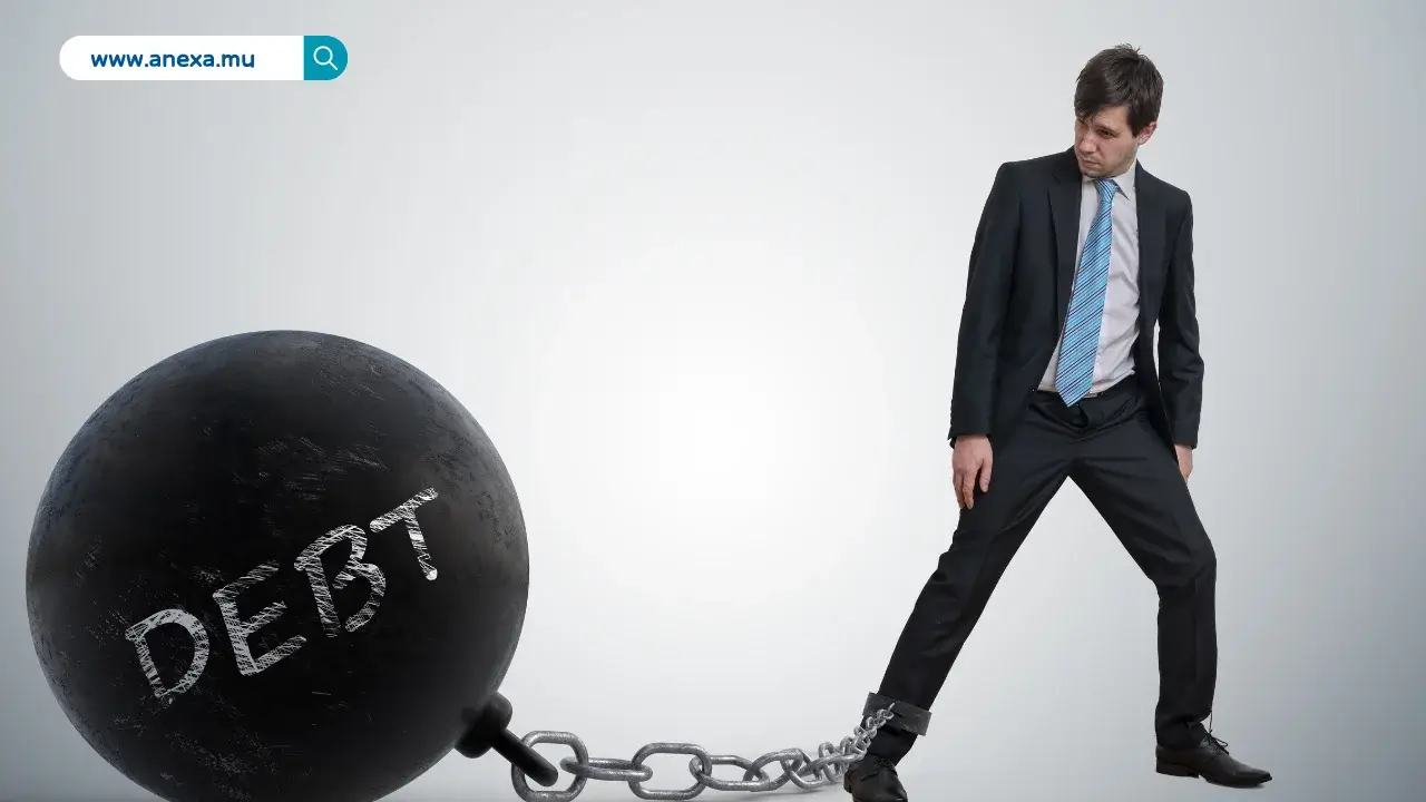 Person breaking free from chains symbolising escaping the debt trap in Mauritius
